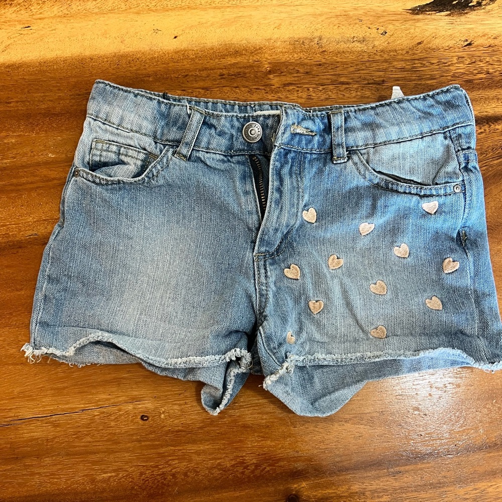 Cute jeans short for girls with embroidered hearts.